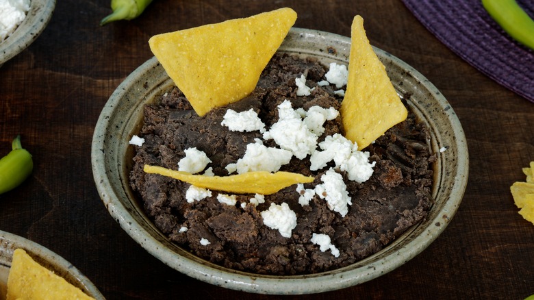 black bean dip with chips and cheese