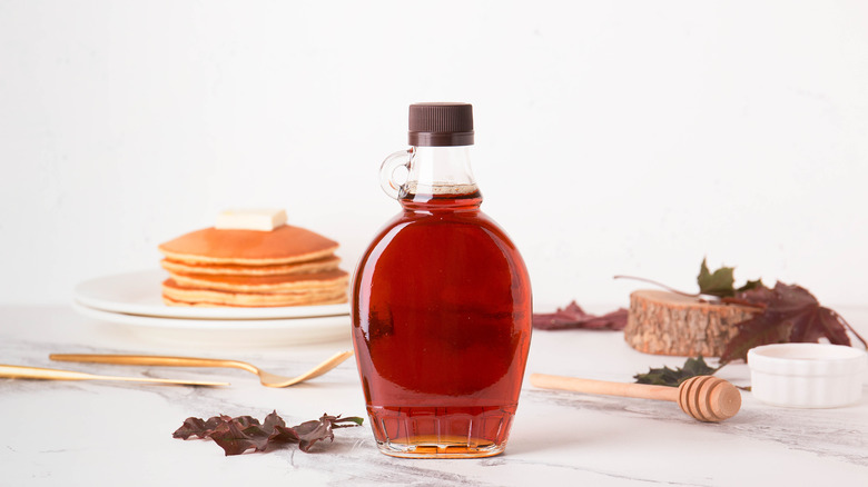 maple syrup jar and pancakes