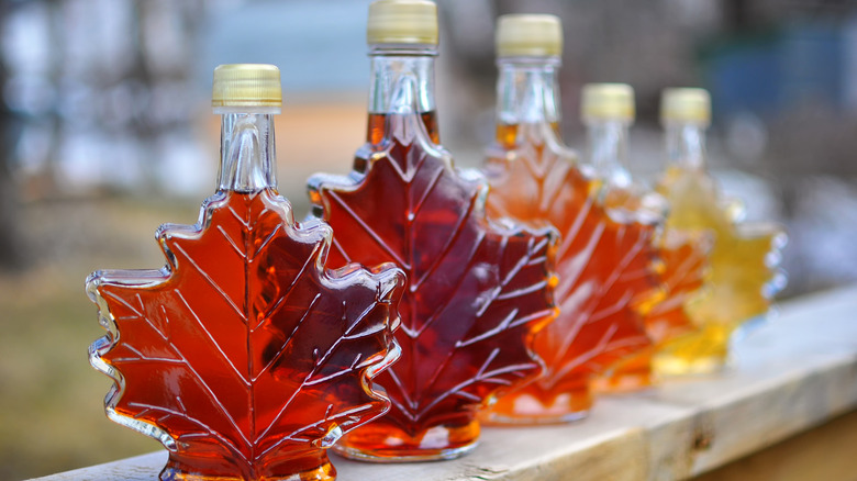 five maple syrup jars