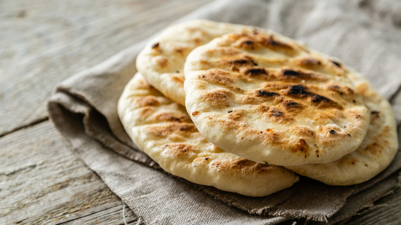 Pita bread on fabric napkin