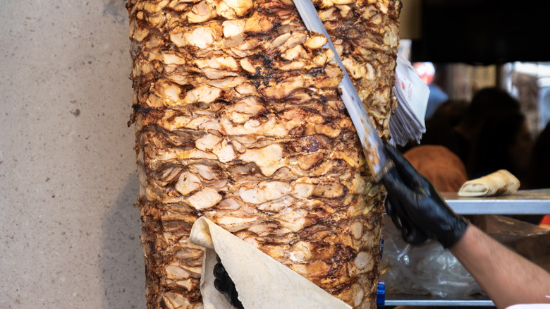 Shawarma meat being cut