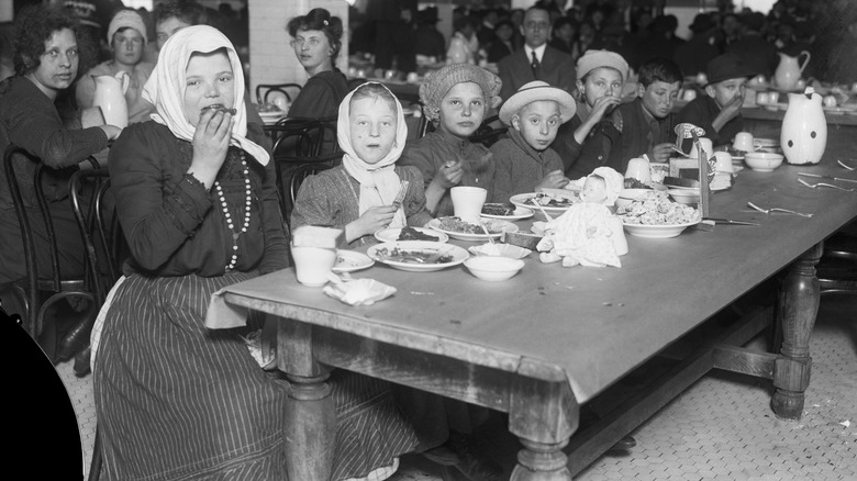 immigrants eating Christmas dinner on Ellis island