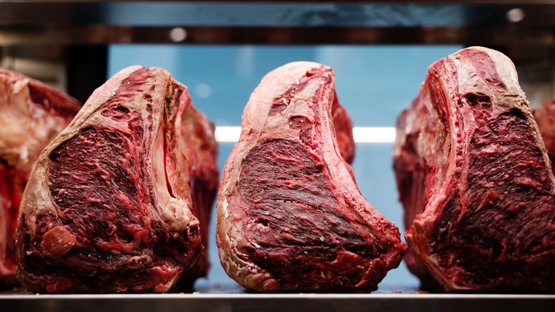 Dry-aged steaks on table