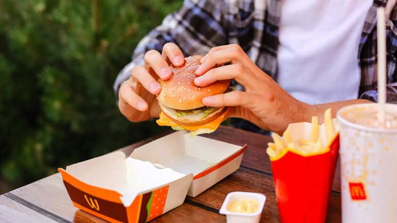 man holding burger