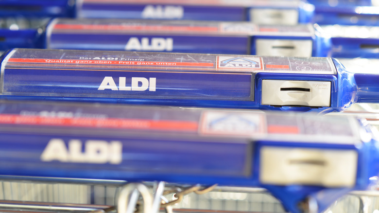 Aldi's carts in a row waiting for quarters