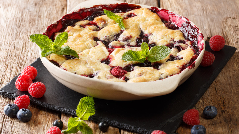 mixed berry pie with mint garnish