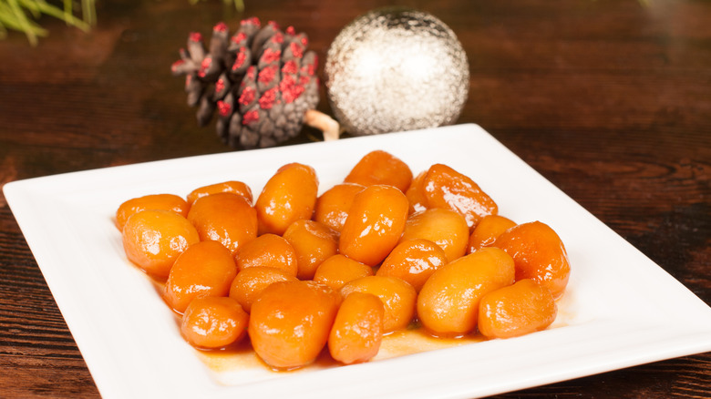 Danish brown potatoes on white plate