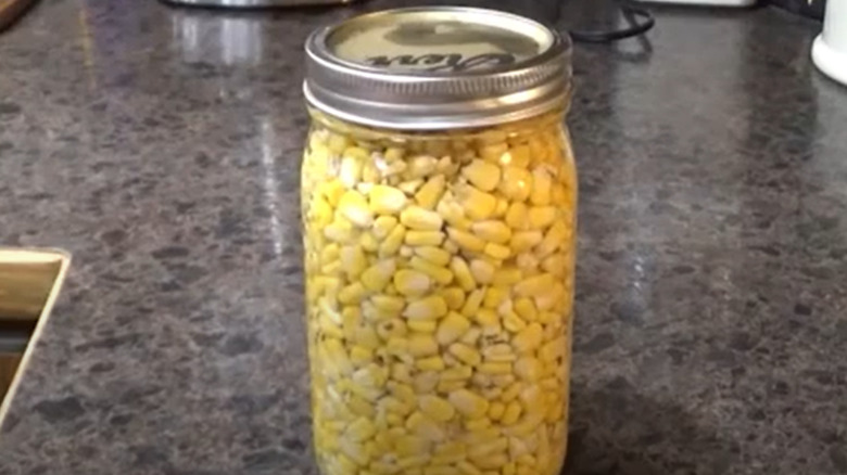 Corn in jar of water