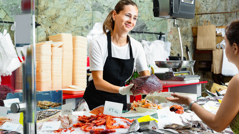 Women buying fresh seafood
