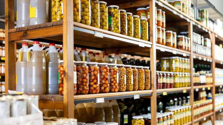 jars of olives on shelves