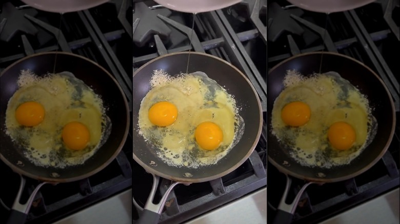 cooking parmesan eggs in pan