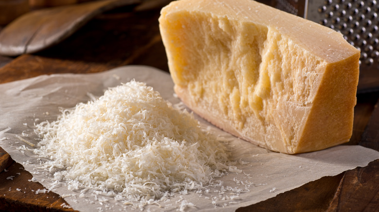 partially grated parmesan cheese block