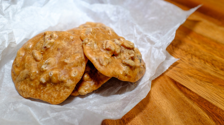 Three pralines on wax paper