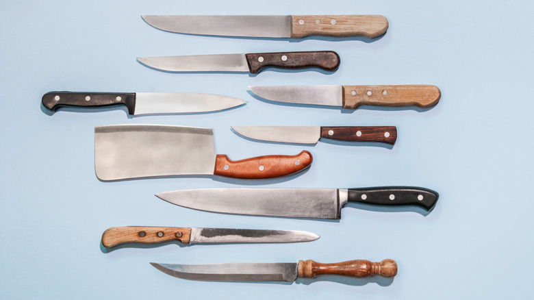 Culinary knives on blue background