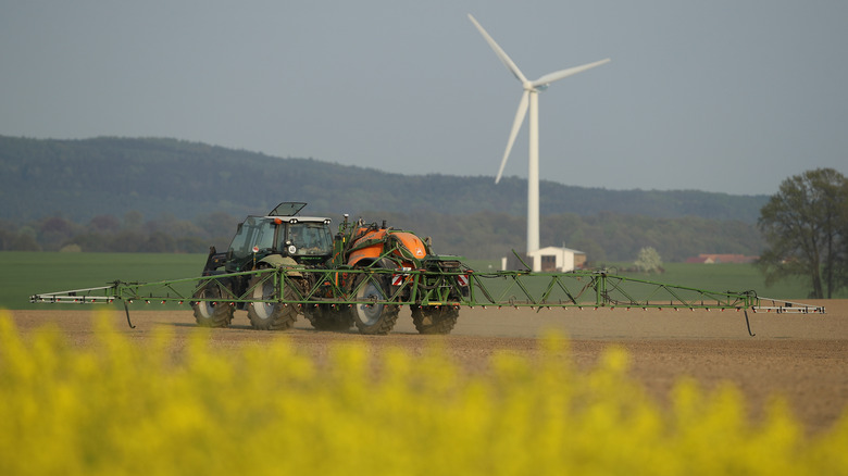 A tractor spraying pesticides 