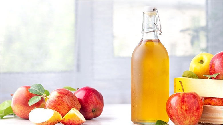 Apple cider vinegar with apples