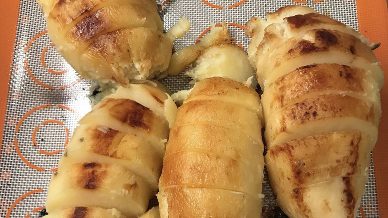 Baked white sweet potatoes on cooling tray