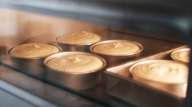 Cake batter baking in oven