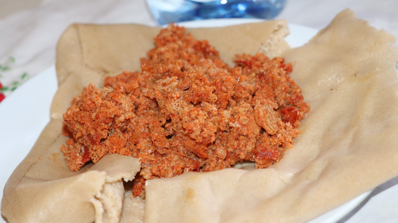 Firfir served on injera bread