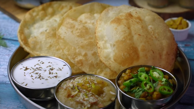 Puri flatbreads with pudding