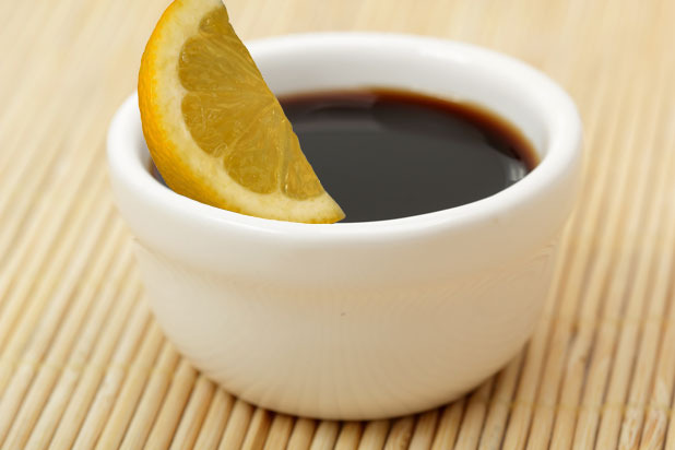 Lemon Wedges Dipped in Soy Sauce