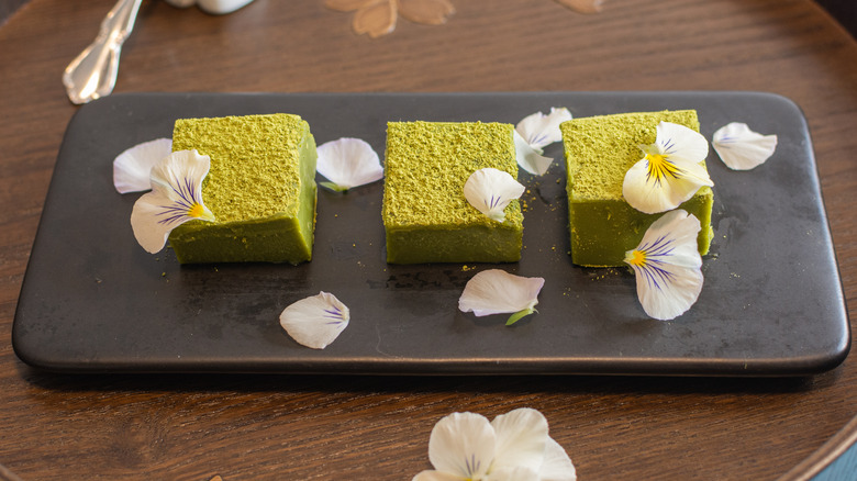 Matcha green tea chocolate squares with edible flowers