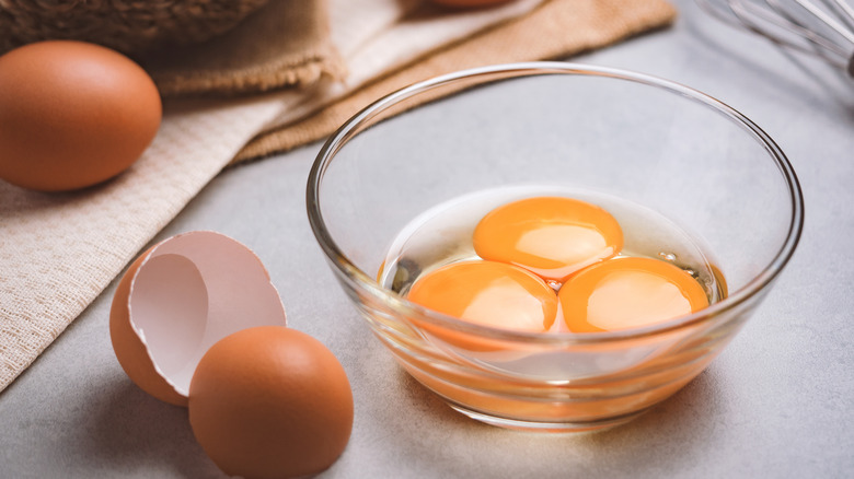 three eggs in a bowl 