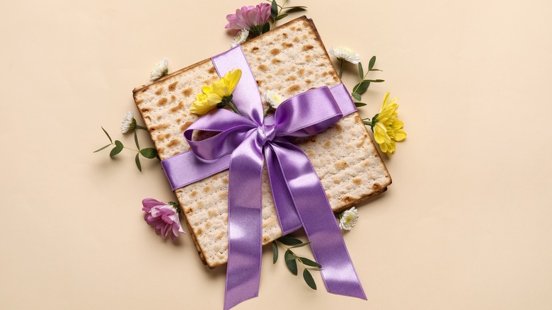 kosher cracker wrapped in a purple ribbon