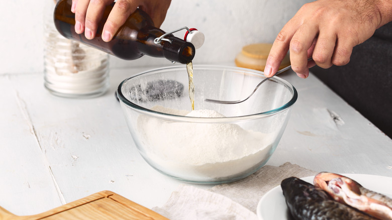 pouring beer into beer batter