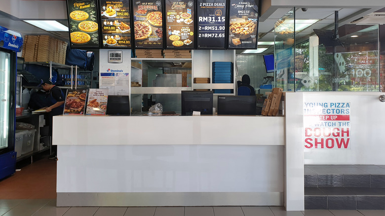 Domino's employees working in kitchen