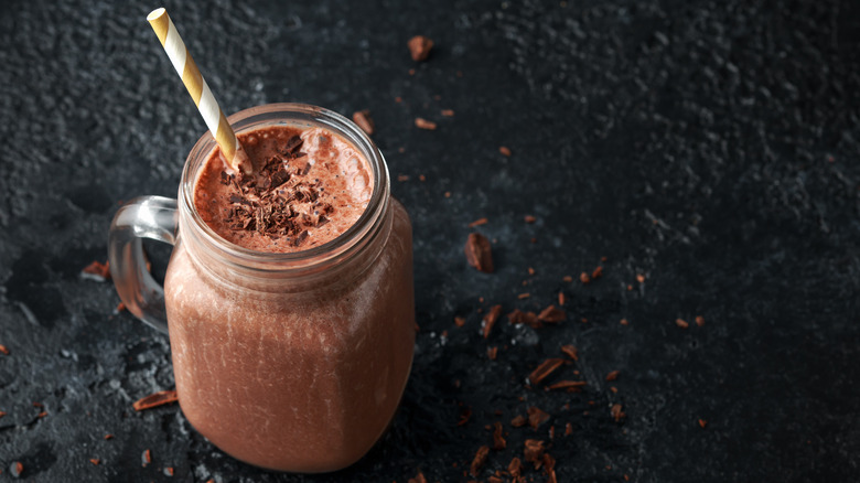 smoothie in jar with cocoa nibs on top