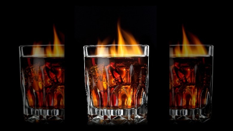 glass of soda in flames