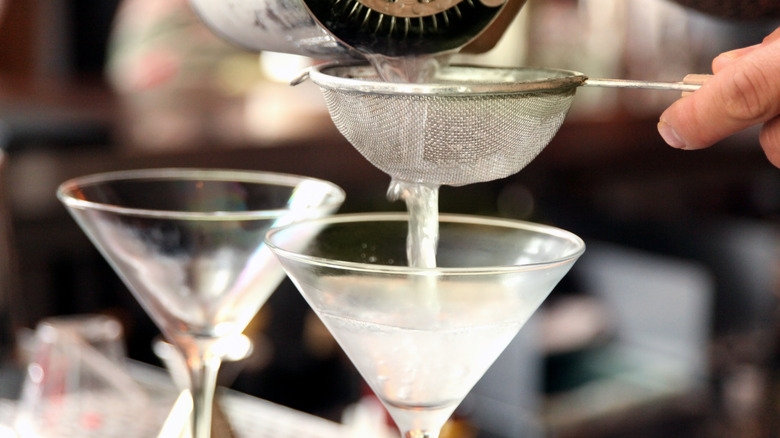 pouring two martinis