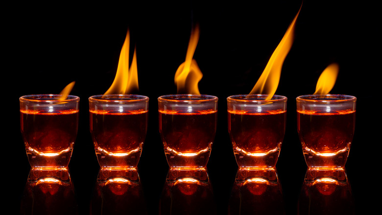 Line of flaming shotglasses