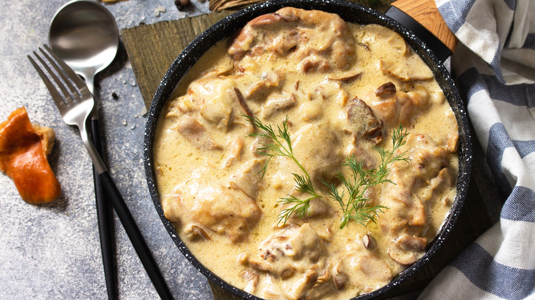 Creamy chicken fricassee in pan