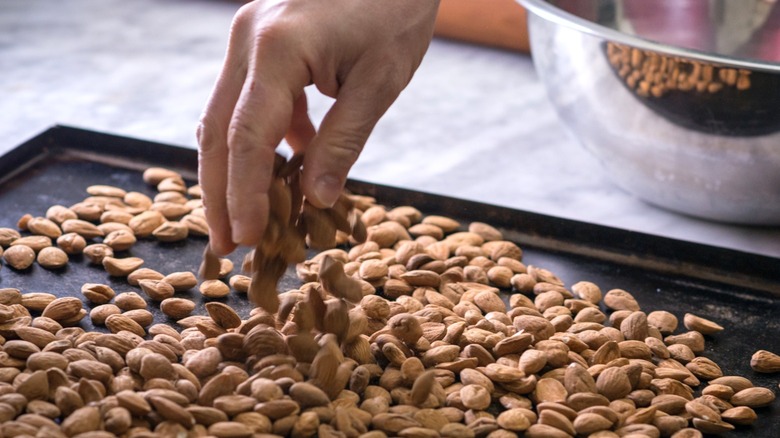 Toasting almonds on a big tray