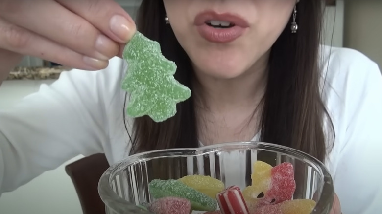 woman eating swedish candy