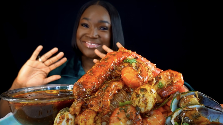 Woman with pile of seafood