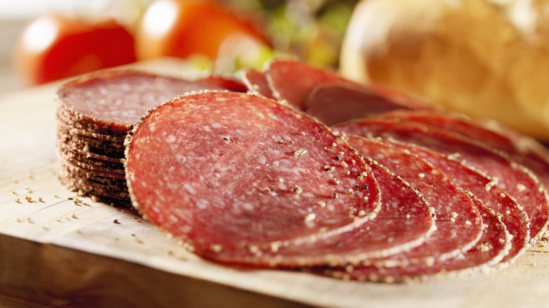 sliced salami on a chopping board