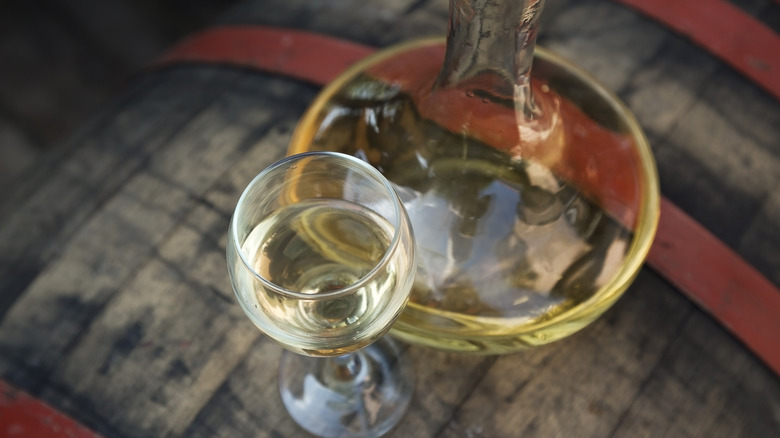 White wine in a decanter and a wine glass