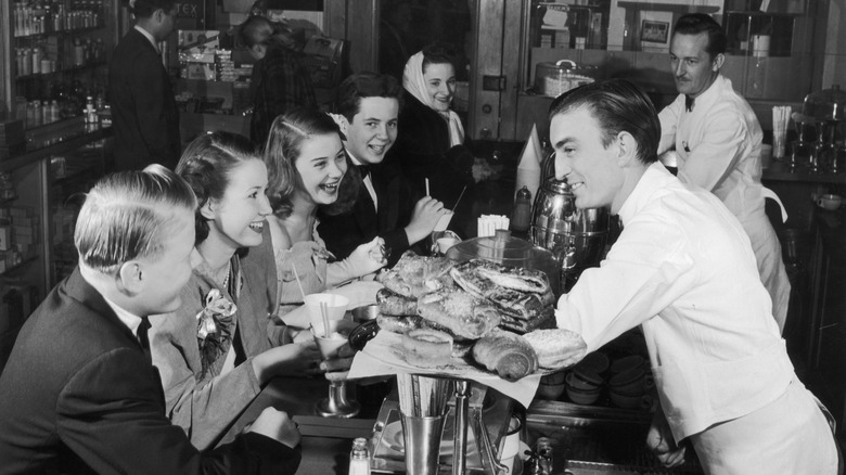 Customers at a pharmacy soda fountain