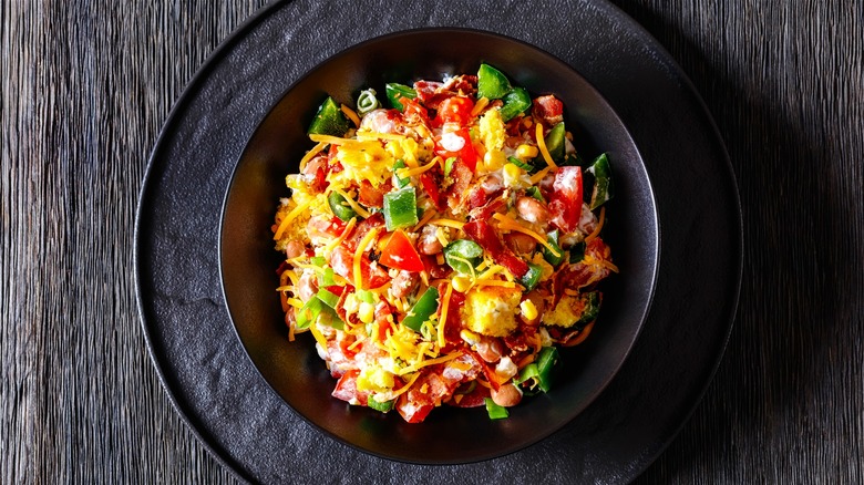 Cornbread salad in black bowl 