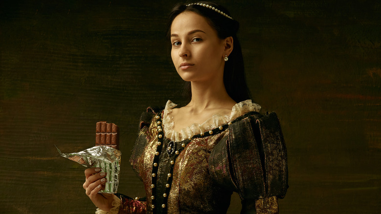 noblewoman holding bar of chocolate