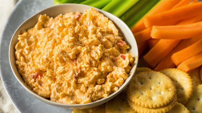 Bowl of pimento cheese and veggies 