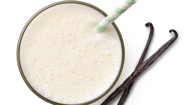 Glass of vanilla milk with straw