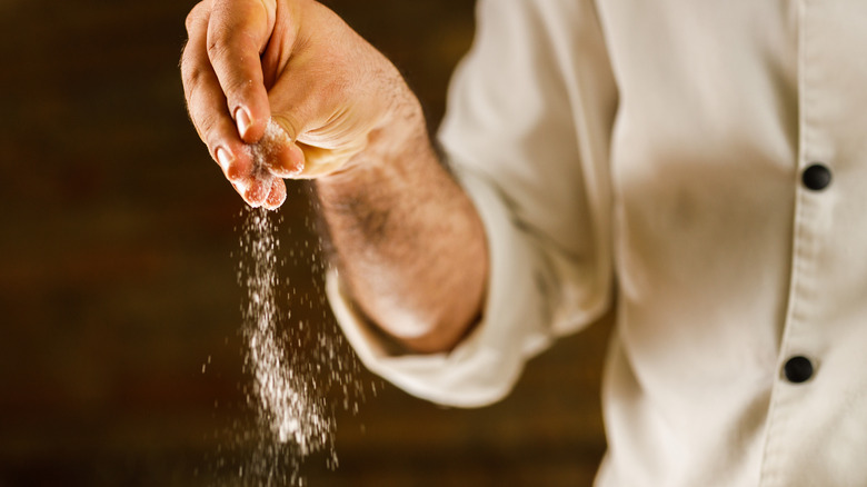 Hand seasoning with salt