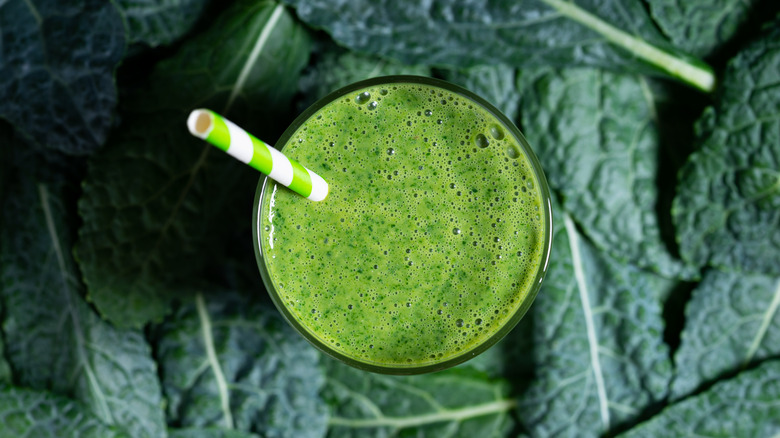 Kale green smoothie with straw