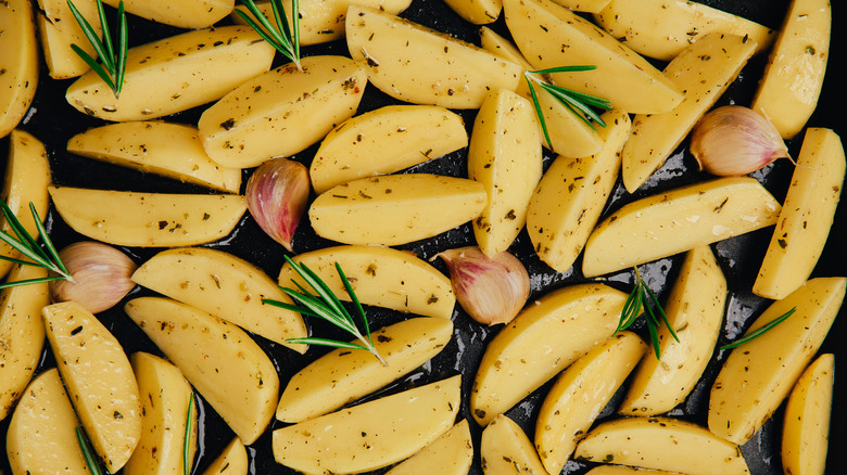 Potatoes and garlic on tray