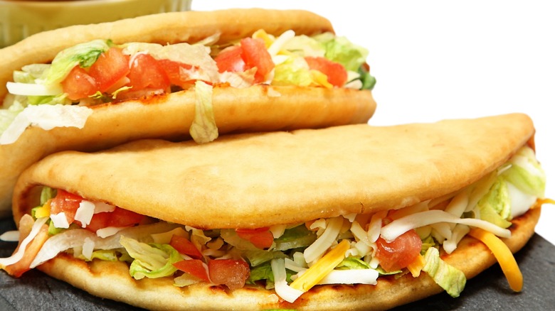 Two puffy taco shaped chalupas