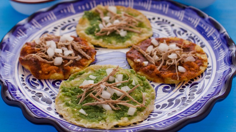 Various chalupas on a plate